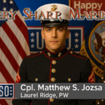 Corporal Matthew S. Jozsa poses in his Marine Corps dress blues against a backdrop of American and military flags, with holiday decorations behind him. Text above reads “Very Sharp, Marine,” and a USO-style lower third displays his name and hometown, Laurel Ridge, PW.